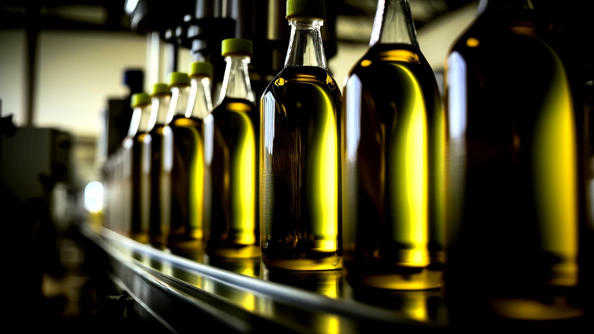 Bottles of olive oil in a factory assembly line