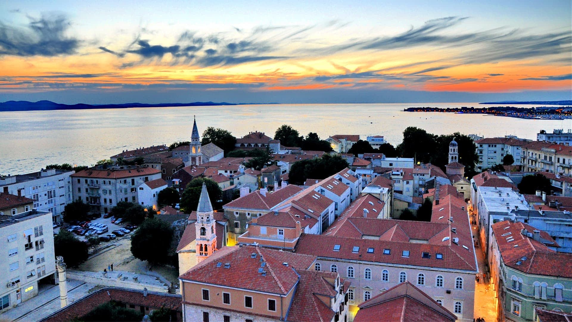 Aerial view of Zadar city with rooftops and the sea during sunset. - Olive Oil Times
