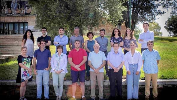 Group photo featuring members of UCOLIVO standing outdoors in a line. - Olive Oil Times